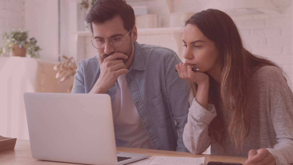 couple researching on computer